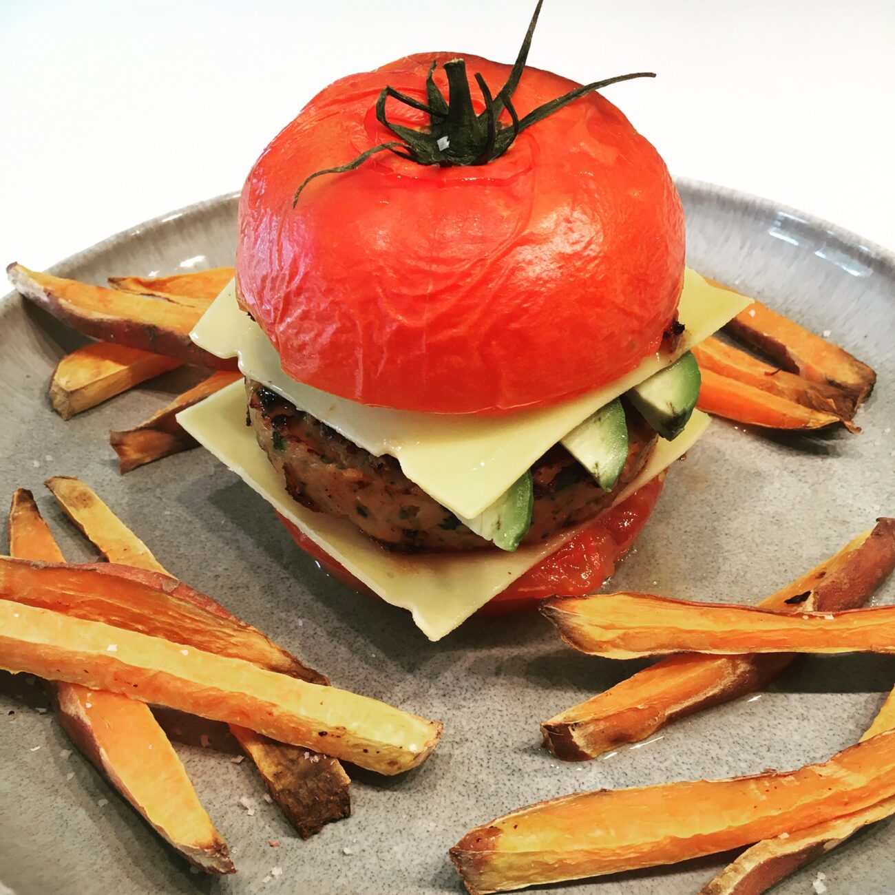Shrimp Burger in a tomato bun with sweet potato fries